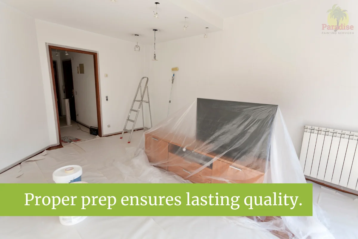 Living room prepped with covers and tools before painting.